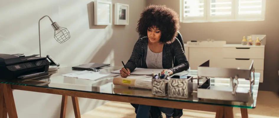 Lady writing at desk